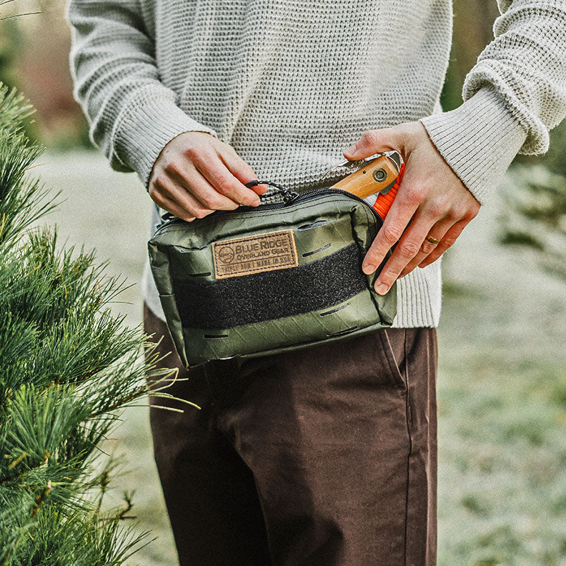 Close up of person with Bum Bag XL fanny pack (made in the USA by Blue Ridge Overland Gear) in outdoor scene.